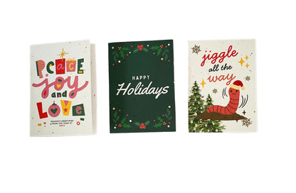 Three Christmas-themed greeting cards on a white background