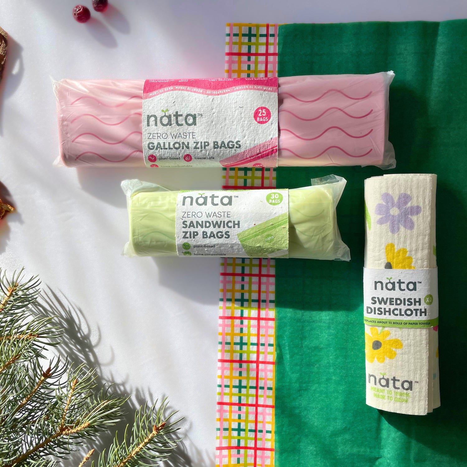 Various nata products including zip bags and a dishcloth on a white and green background with decorative elements.